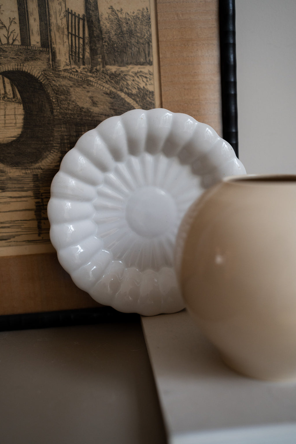 Crèmekleurige wandbord