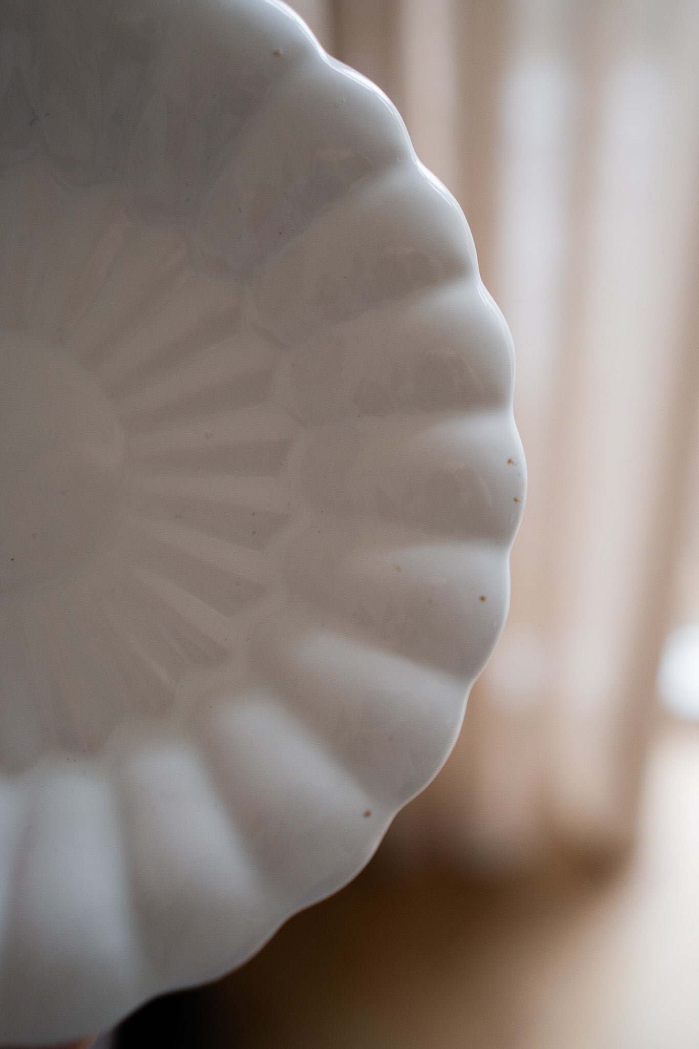 Crèmekleurige wandbord